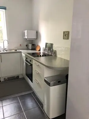 a kitchen with a sink and a stove top oven at Flat 2 Frank Lewis House in Hay-on-Wye