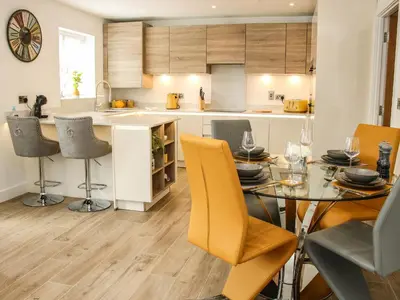 a kitchen and dining room with a table and chairs at 42 Albury Place in Shrewsbury