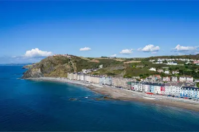 an aerial view of a beach with buildings and the ocean at 1 Bed in Aberystwyth oc-bow285 in Aberystwyth