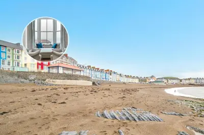 a view of a beach with a building on it at 1 Bed in Aberystwyth oc-bow285 in Aberystwyth