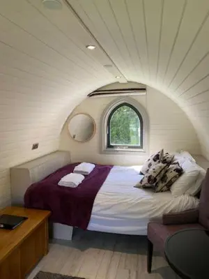a bedroom with a bed in a small room at The Pod in Aberystwyth