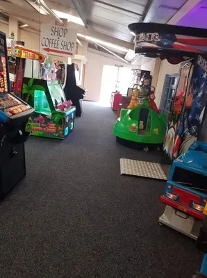 a room with a coffee shop with toys in it at D19 in Aberystwyth
