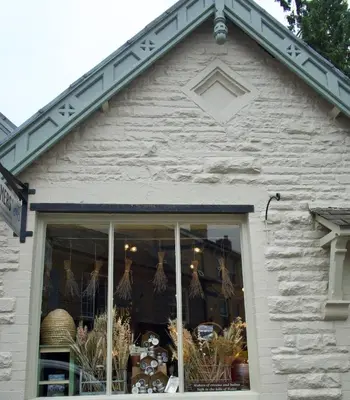 a store front with awning over a window at The Pavement Palace in Hay-on-Wye