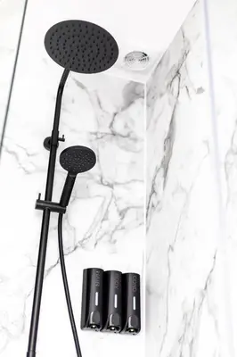 a shower in a bathroom with black and white marble at Ty Belgrave - Apartment 3 in Aberystwyth