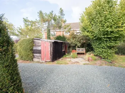 an old shed in the yard of a house at Top House in Forden