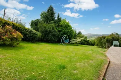 a yard with a sign in the grass at 4 Bed in Cray oc-bow288 in Cray