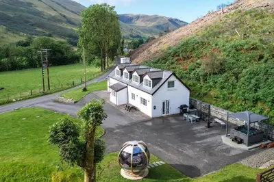 an aerial view of a white house on a hill at 3 Bed in Aberystwyth oc-bow297 in Pentre-briwnant