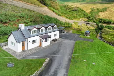 an aerial view of a house on a hill at 3 Bed in Aberystwyth oc-bow297 in Pentre-briwnant