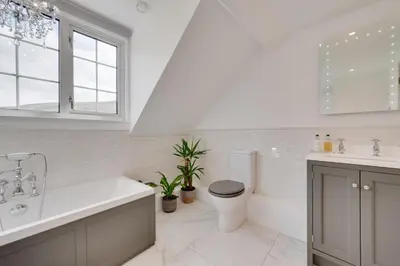 a white bathroom with a toilet and a sink at 3 Bed in Aberystwyth oc-bow297 in Pentre-briwnant
