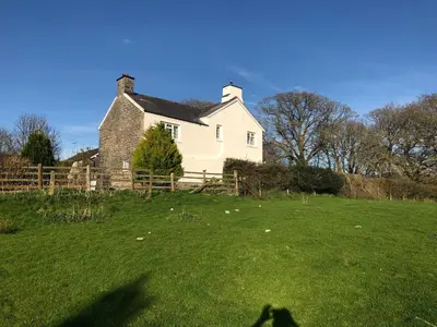 a shadow of a person in front of a house at Pengarreg Fawr in Aberystwyth