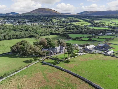 an aerial view of a village in the hills at Bennar Fawr in Dyffryn