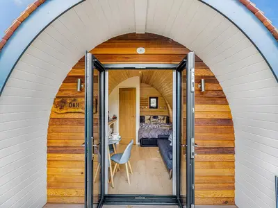 an archway leading into a room with a bedroom at Oak-Uk36258 in Llanfair Caereinion