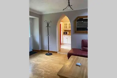 a living room with a couch and a table at Hendre Fechan Cottage, Nr Barmouth, Pets welcome, beautiful views. in Llanddwywe
