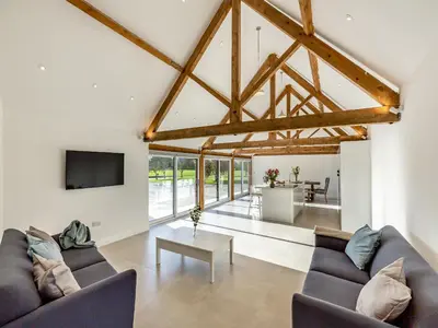 a living room with two couches and a tv at Buckley Farm, Barn 1 - Uk36588 in Oswestry
