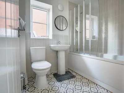 a bathroom with a toilet and a sink at 2 Bedroom Home Near the Heart of Ludlow - Pass the Keys in Ludlow