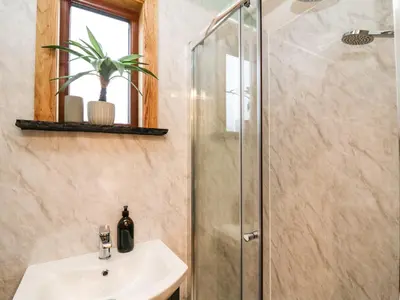 a bathroom with a sink and a shower at Highland View in Rhayader
