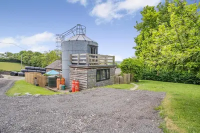 a house with a tower on the side of a road at 1 Bed in Aberaeron oc-bow300 in Henfynyw Upper