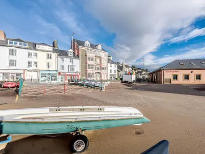 a boat sitting on the street in a city at Apartment 1 - Uk32244 in Aberdyfi