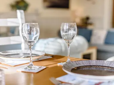 two empty wine glasses sitting on a table at Apartment 1 - Uk32244 in Aberdyfi