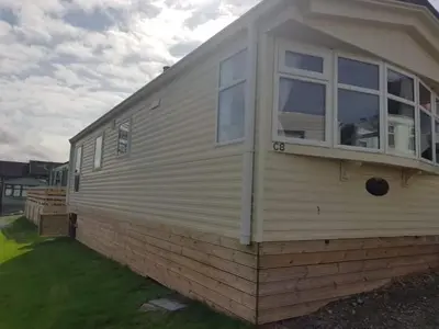 a house with a dog sitting in a window at C8 in Aberystwyth