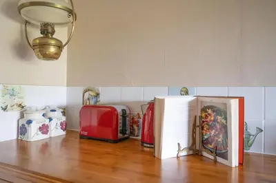 a room with a table with luggage and a light at Panoramic Mountain Retreat - Waen Fechan - 4x4 access only in Dolgellau