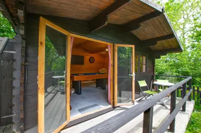a cabin with an open door with a desk on a deck at 4 Bed in New Quay oc-bow272 in New Quay