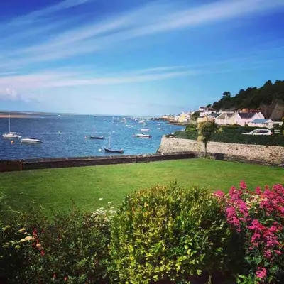 a view of a body of water with boats in it at Pebble Cottage in Aberdyfi
