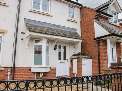 a red brick house with a white door at Pippin's Place in Shrewsbury