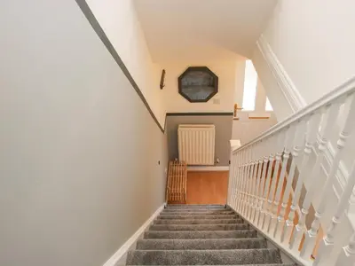 a staircase in a house with a stair case at Pippin's Place in Shrewsbury