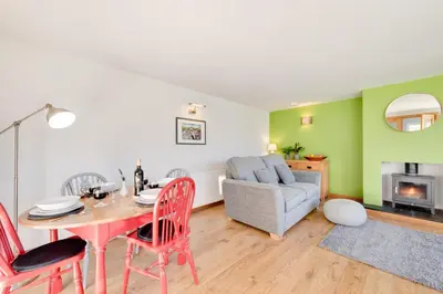 a living room with a table and chairs and a couch at 2 Bed in Tregaron oc-bow298 in Tregaron