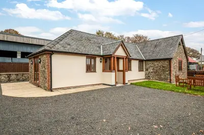 a detached house with a gravel driveway at 2 Bed in Y Drenewydd oc-waa402 in Llanllugan