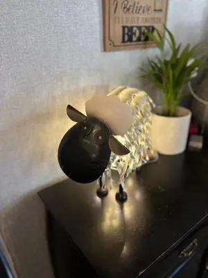 a small figurine of a sheep sitting on a table at The Queens Hotel Harlech in Harlech