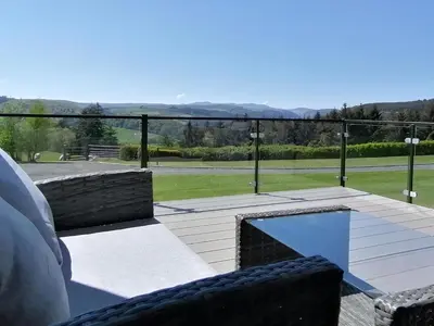 a view of a patio with a swimming pool at Lake Vyrnwy Luxury Glamping Pod 2 in Llanwddyn