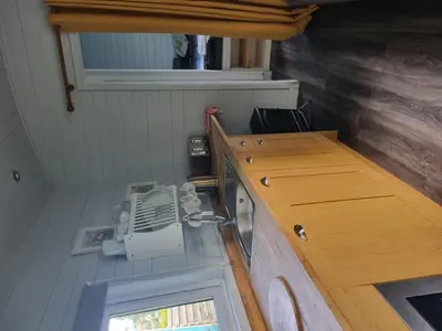 an inside view of a small room with a phone in it at Glamping Hut - Riverview 3 in Welshpool