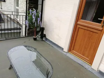 a mirror on a porch next to a door at 1 Park Terrace in Corris