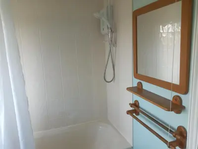 a bathroom with a mirror and a shower at Swn Y Gwy ~ The Sound of the Wye in Brecon
