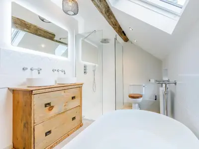 a bathroom with two sinks on a wooden dresser at Little Whitley - Uk38099 in Great Hanwood