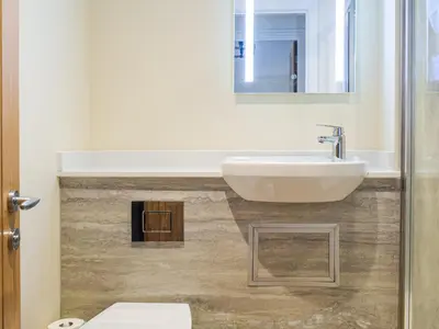 a bathroom with a sink and a mirror at Wheelwright Cottage in Clunbury