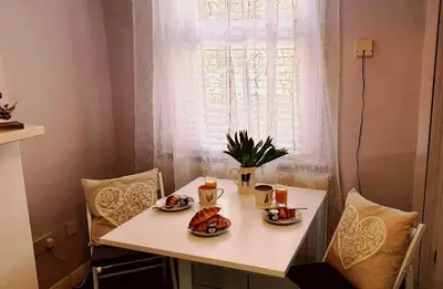 a table with two plates of food on it at Central cosy home 5 minutes walk from Shrewsbury - Pass the Keys in Shrewsbury