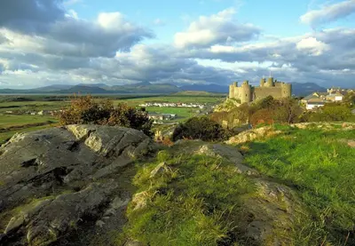 a castle on top of a hill with rocks at 1 Bed in Dolgellau oc-bow283 in Trawsfynydd