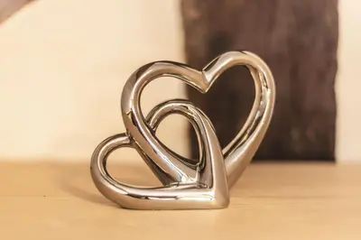 a metal heart shaped object sitting on a table at River Cottage, Melverley in Melverley