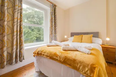 a bedroom with a large window and a bed at 5 Bed in Llandovery oc-bow323 in Llangadog
