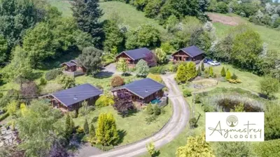 an aerial view of a house with a road leading to it at Countryside Log Cabin With Hot Tub - Beech in Leominster