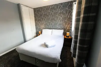a hotel room with a bed with a pillow on it at Cul-de-sac Creations in Shrewsbury