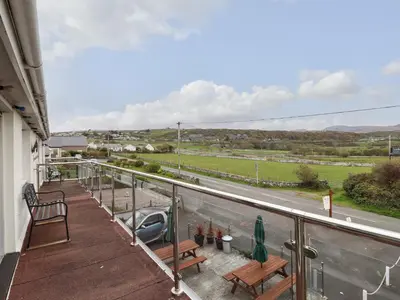 a balcony with a view of a road at Morlyn Guest House Apartment in Harlech