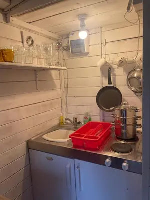 a small kitchen with a sink and a stove at Ty Bach Twt, Coity Bach in Brecon