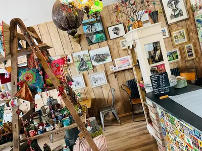 a room filled with lots of items on a wall at The Art Attic a Stylish Boutique Apartment in Builth Wells