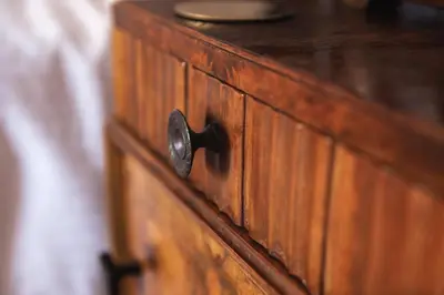 a wooden dresser with a knob on it at RHUBARB at Drapers Hall in Shrewsbury