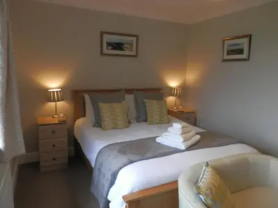 a bedroom with a bed with towels on it at Beaconsview B&B in Brecon