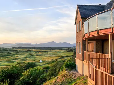 a house on a hill with a view of the countryside at Tir Gafr in Harlech